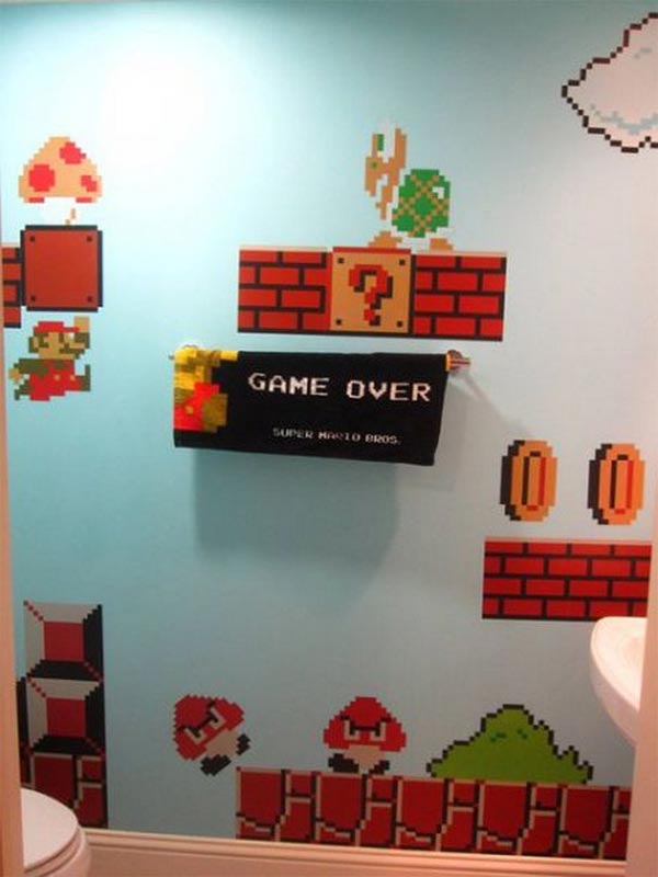 walls of toilet decorated with Super Mario theme