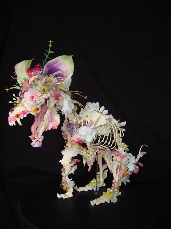 Flower-covered skeleton sculpture