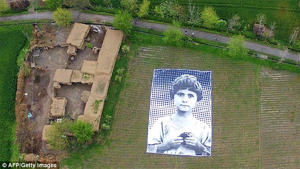 Giant Poster of Girl  Aims To Make Remote Aircraft Operators Think Before They Bomb