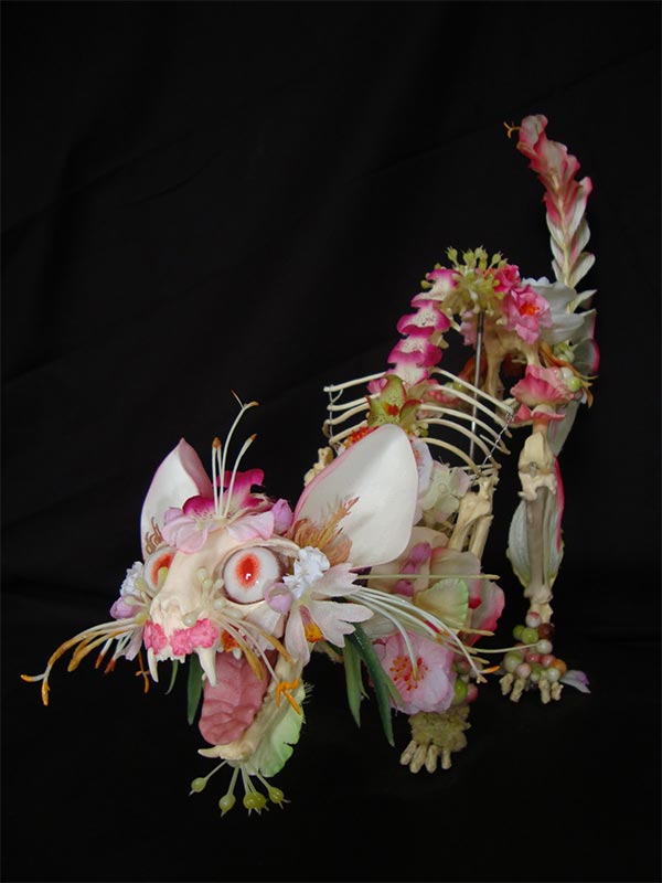 Flower-covered skeleton sculpture