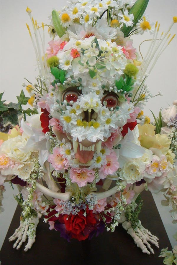 Flower-covered skeleton sculpture