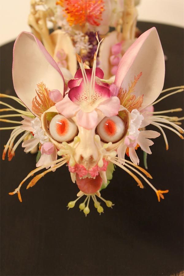 Flower-covered skeleton sculpture