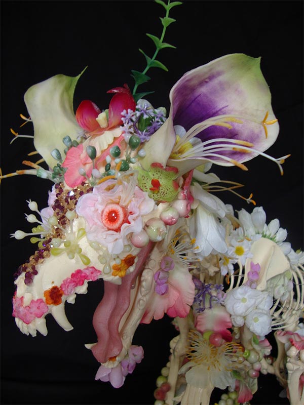 Flower-covered skeleton sculpture