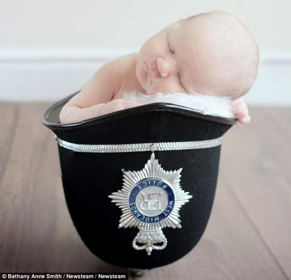 Policeman's Four-Day-Old Daughter Sleeping in His Helmet