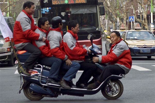 Five men on electric bicycle