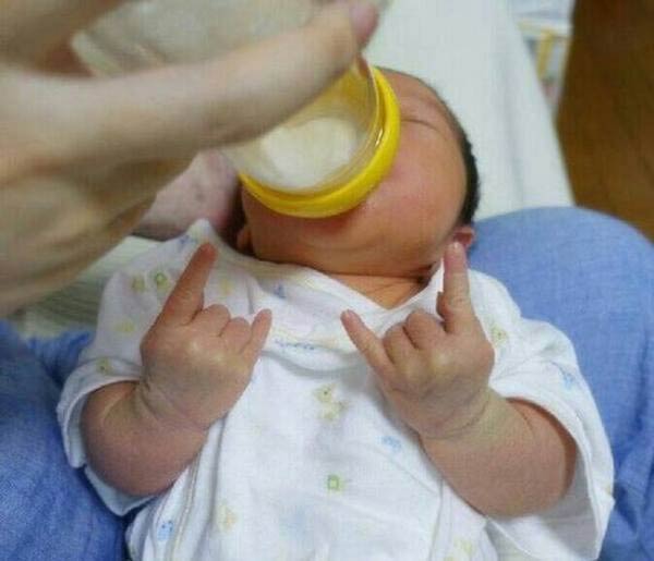 Funny Fingers Expressions of Baby Drinking Milk