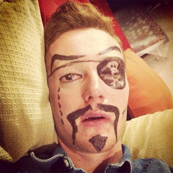 Pirate Face Drawn on Drunk Guy