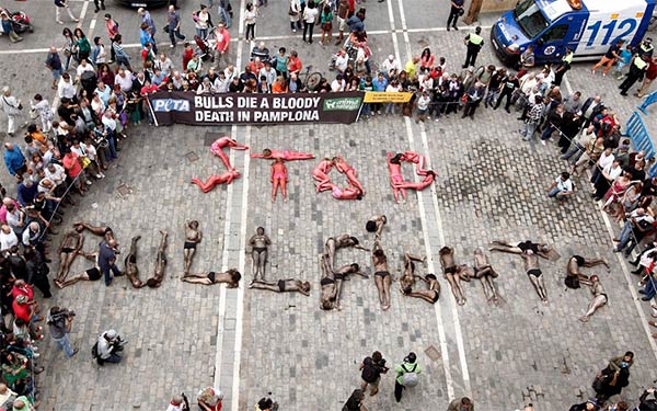 PETA Protestors Forming The Words STOP BULLFIGHTING