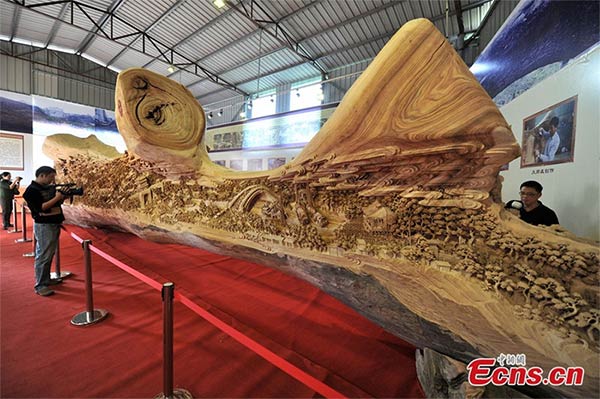 Sculptor Zheng Chunhui Spent 4 Years Carving the World’s Longest Wooden Sculpture