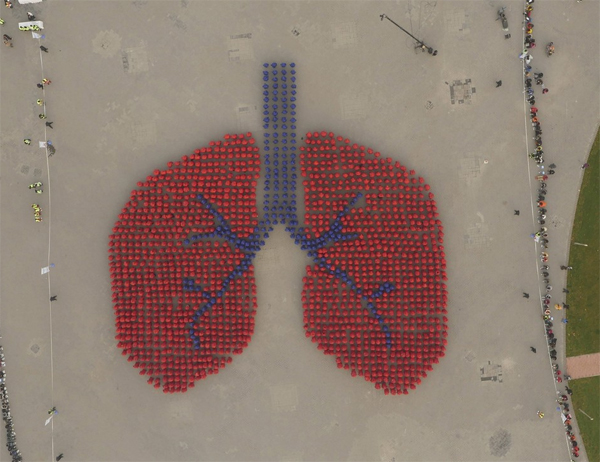 People Forming An Image Depicting Human Lung