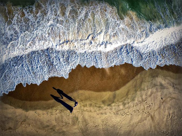 Perfectly-Timed Couple's Aerial Photo