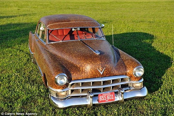Family cover their classic Cadillac in more than 38,000 cents