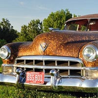 Family cover their classic Cadillac in more than 38,000 cents