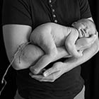 Baby Poops On His Father's Hand During Family Photo Shoot