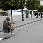 Tunisian Man Holds Back Riot Police with a Baguette