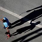 Beautiful Shadow of Father & Son Stretched Along The Road