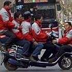 Five Men On An Electric Bicycle