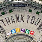 People Sitting In The Formation To The Words "Thank You"