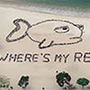 Kids Forming Giant Reef Fish On Beach