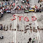 “STOP BULLFIGHTING” Words Formation By PETA Protestors