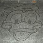 Janitor At Disney World Draws Cartoon Characters with Broom & Water To Entertain Guests