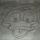 Janitor At Disney World Draws Cartoon Characters with Broom