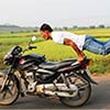 Indian Man Performs Yoga Poses On Speeding Motorbike